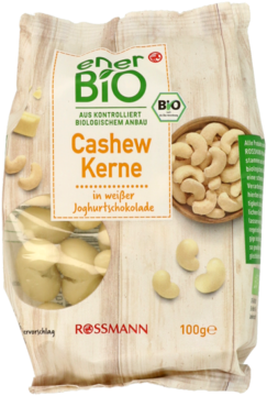 EnerBio BIO Orzechy nerkowca w białej czekoladzie jogurtowej 100g, jasne opakowanie z grafiką drewna, widok z przodu.