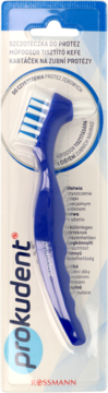 Szczoteczka do protez Prokudent w blisterze. Niebieska, z ergonomiczną rączką i podwójnym włosiem, widok z przodu.