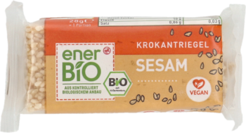 Baton EnerBio sezamowy Krokantriegel w brązowym opakowaniu z zielonym logo i napisem Vegan, widok z góry.