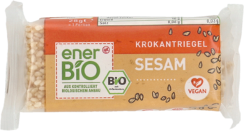 Baton EnerBio sezamowy Krokantriegel w brązowym opakowaniu z zielonym logo i napisem Vegan, widok z góry.