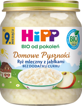 Słoik Hipp Domowe Pyszności Ryż mleczny z jabłkami BIO bez cukru, z miską, jabłkiem i zieloną etykietą.