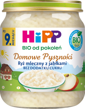 Słoik Hipp Domowe Pyszności Ryż mleczny z jabłkami BIO bez cukru, z miską, jabłkiem i zieloną etykietą.