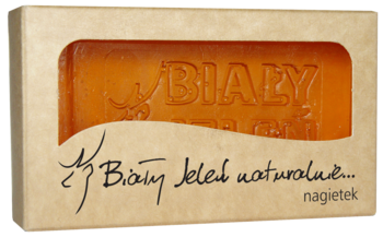 Mydło glicerynowe Biały Jeleń nagietek w ekologicznym pudełku, pomarańczowa kostka z logo, widok z przodu.