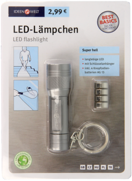 Kompaktowa srebrna latarka LED z brelokiem i 4 bateriami AG-13, widoczna w przezroczystym blistrze.