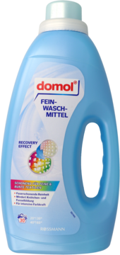 Domol Fein-Waschmittel w jasnoniebieskiej butelce, widok z przodu. Z grafiką Recovery Effect, do delikatnych tkanin.