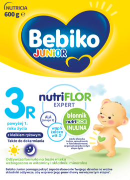 Żółto-niebieskie opakowanie Bebiko Junior 3R nutriFLOR Expert 600g, z misiem i składnikami ALA, wit. D.