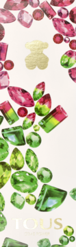 Perfumy Tous Gems Power. Złote logo misia wśród błyszczących różowych i zielonych kamieni na jasnym tle. Widok z góry.