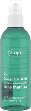 Ziaja tonik z liśćmi manuka w przezroczystej butelce z turkusowym płynem i białym spryskiwaczem.