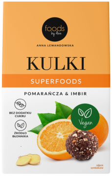 Kulki Superfoods Pomarańcza & Imbir od Foods by Ann. Pomarańczowo-białe pudełko, grafika owoców, widok z przodu.