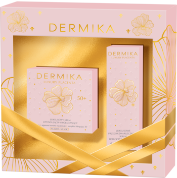 Zestaw Dermika Luxury Placenta 50+ z kremem i serum, w otwartym różowo-złotym pudełku prezentowym.
