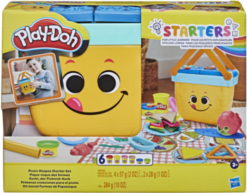 Play-Doh Starters Picnic Shapes Starter Set w kolorowym pudełku z żółtym koszykiem i ciastoliną do tworzenia jedzenia.