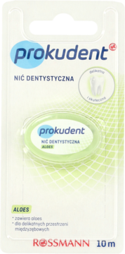 Prokudent nić dentystyczna aloesowa 10m w przezroczystym opakowaniu z zielonym tłem, widok z przodu.