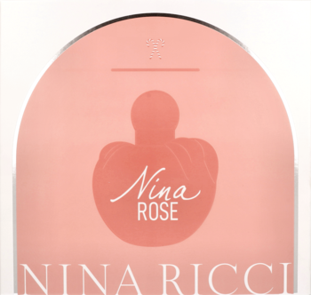 Pastelowy różowy przód opakowania zestawu Nina Rose Nina Ricci z sylwetką flakonu.