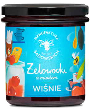 Szklany słoik Żelowocki z miodem Wiśnie, czarna zakrętka, niebieska etykieta z rysunkami misia, pszczoły i wiśni.