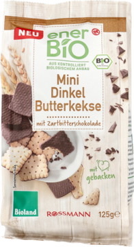 Stojąca paczka enerBiO Mini Dinkel Butterkekse z ciemną czekoladą. Wzór paczki przedstawia herbatniki i ziarna orkiszu.