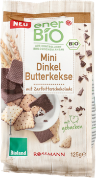 Stojąca paczka enerBiO Mini Dinkel Butterkekse z ciemną czekoladą. Wzór paczki przedstawia herbatniki i ziarna orkiszu.