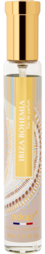 Adopt Ibiza Bohemia Eau de Parfum, przezroczysta butelka ze złotą nakrętką, beżową etykietą i etnicznym wzorem.