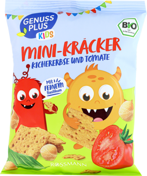 Przednie opakowanie Minikrakersów Genuss Plus Kids ciecierzyca i pomidor, z kreskówkowymi potworkami i warzywami.