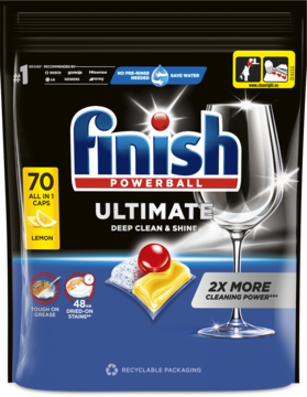 Czarne opakowanie kapsułek Finish Ultimate All in 1 Lemon 70 szt., widok z przodu, z kieliszkiem i kapsułką.