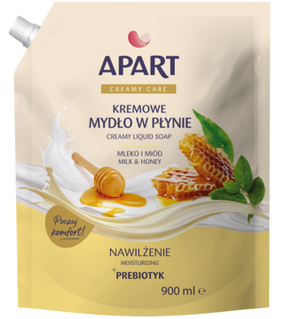 Apart Kremowe Mydło Mleko i Miód 900ml. Beżowa saszetka z prebiotykiem, grafiką mleka i miodu.