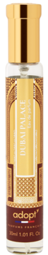 Flakon perfum Adopt' Dubai Palace 30ml, przezroczysta butelka ze złotą nakrętką i beżowo-brązową etykietą, przód.