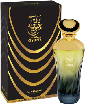 Butelka orientalno-kwiatowej wody perfumowanej Al Haramain Oyuny (złoto-zielona) obok czarnego pudełka z falistymi liniami.