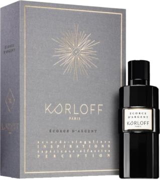 Korloff Ecorce D'Argent uniseks woda perfumowana EDP: ciemna butelka obok szarego pudełka, złoty wzór.