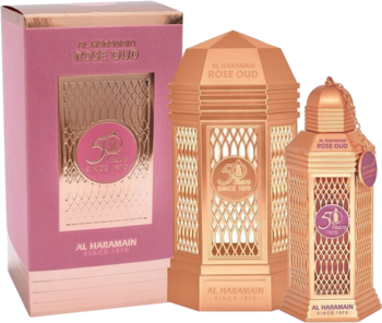 Al Haramain 50 Years Rose Oud perfumy w różowo-złotych butelkach o kształcie lampionu i dopasowanym pudełku.