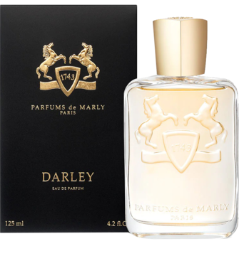 Perfumy Parfums de Marly Darley w przezroczystej butelce z złotym korkiem, z tyłu czarne pudełko z herbem.