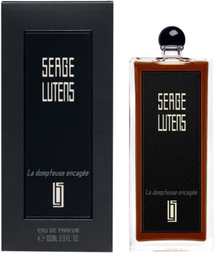 Serge Lutens La dompteuse encagée, woda perfumowana z plumerią, czarne pudełko i brązowa butelka.