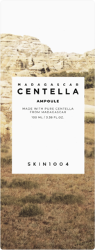 Opakowanie Skin1004 Madagascar Centella Ampoule 100ml, białe, z widokiem na skalisty krajobraz, front.