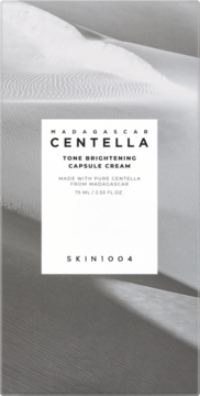 Madagascar Centella Tone Brightening Capsule Cream, monochromatyczne opakowanie z fakturą piasku, widok z przodu.