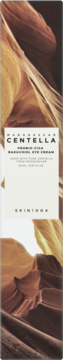 Skin 1004 Madagascar Centella Probio-Cica Bakuchiol Eye Cream w kartoniku, biała etykieta, tło w brązowe skały, widok z przodu.