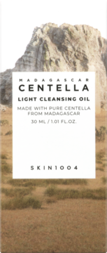 SKIN1004 Madagascar Centella Light Cleansing Oil, white bottle label, 30ml, against a rocky, earthy landscape.