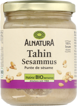 Alnatura Tahin Sesammus 100% sezamu w szklanym słoiku, beżowa etykieta z logo BIO, widok z przodu.