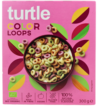 Widok z przodu różowego opakowania płatków Turtle Color Loops, z miską kolorowych, bezglutenowych pętelek zbożowych.