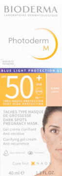Białe opakowanie Bioderma Photoderm M SPF 50+ Light, kremu-żelu na przebarwienia, z pomarańczowymi napisami i logo.