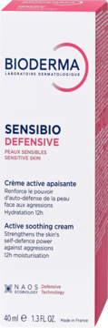 Białe pudełko kremu Bioderma Sensibio Defensive, widok z przodu, z różowymi detalami i niebieskim napisem.