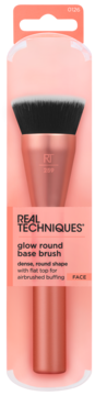 Pędzel Real Techniques Glow Round Base w brzoskwiniowym opakowaniu, z gęstym włosiem i różowo-złotą rączką.