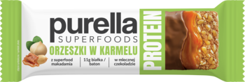 Baton białkowy Purella Protein Orzeszki w Karmelu, zielono-białe opakowanie z orzechami laskowymi, widok z przodu.
