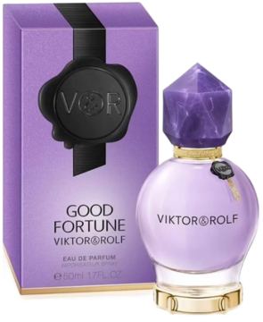 Fioletowy flakon Viktor & Rolf Good Fortune EDP z fasetowanym korkiem i breloczkiem klucza, obok pasujące pudełko.