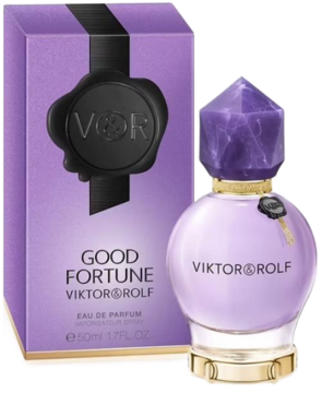 Fioletowy flakon Viktor & Rolf Good Fortune EDP z fasetowanym korkiem i breloczkiem klucza, obok pasujące pudełko.