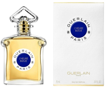 Guerlain L'Heure Bleue orientalno-kwiatowa woda perfumowana. Butelka z przezroczystego szkła obok białego opakowania.