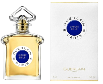 Guerlain L'Heure Bleue orientalno-kwiatowa woda perfumowana. Butelka z przezroczystego szkła obok białego opakowania.