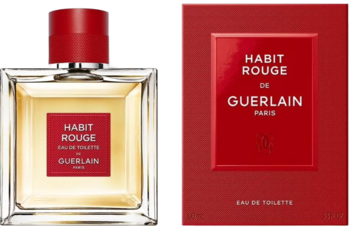 Woda toaletowa Guerlain Habit Rouge: flakon z czerwoną nakrętką i czerwone pudełko obok, widok z przodu.