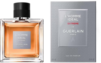 Woda perfumowana Guerlain L'Homme Ideal Extreme: szklana butelka z bursztynowym płynem i szare pudełko.
