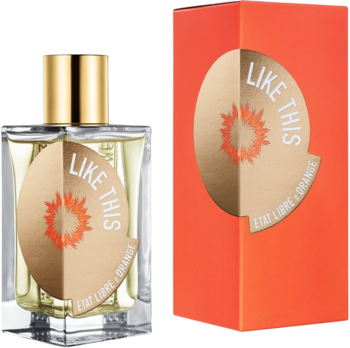 Butelka perfum Like This Etat Libre d'Orange: przezroczysta, złota etykieta, obok pomarańczowego pudełka.