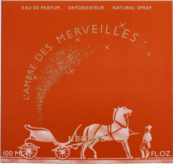 Pomarańczowe pudełko perfum Hermes L'Ambre Des Merveilles 100ml ze złotym koniem, wozem i brokatowymi gwiazdami.