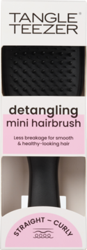 Tangle Teezer detangling mini hairbrush w czarnym kolorze, w białym opakowaniu z różowymi akcentami, dla włosów prostych i kręconych.