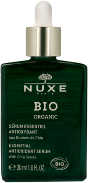 Nuxe Bio Organic serum antyoksydacyjne z nasionami chia w ciemnozielonej butelce ze złotym dropperem, widok z przodu.